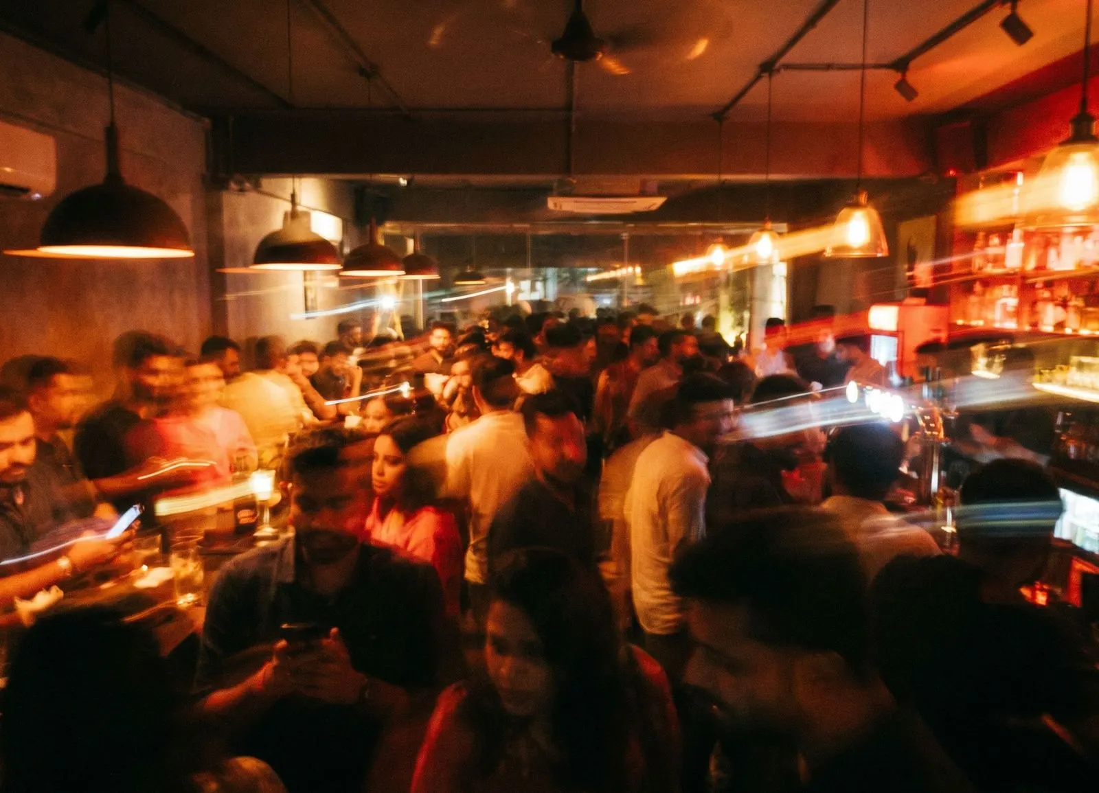 Motion-blurred crowd in a bar
